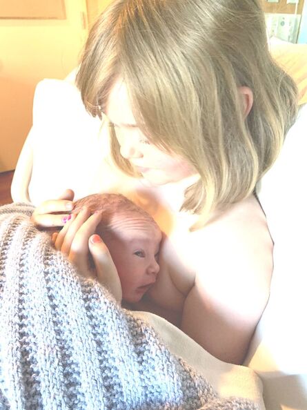 Young girl holding newborn baby after my mindful birth